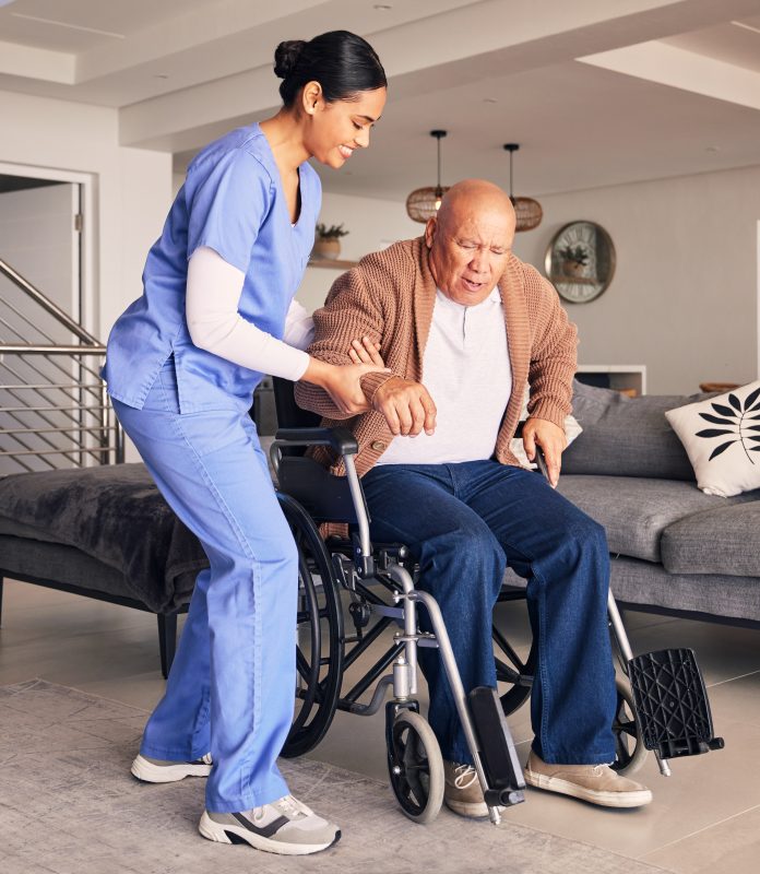 In-home Care Gvier safely assisting client out of wheelcahir